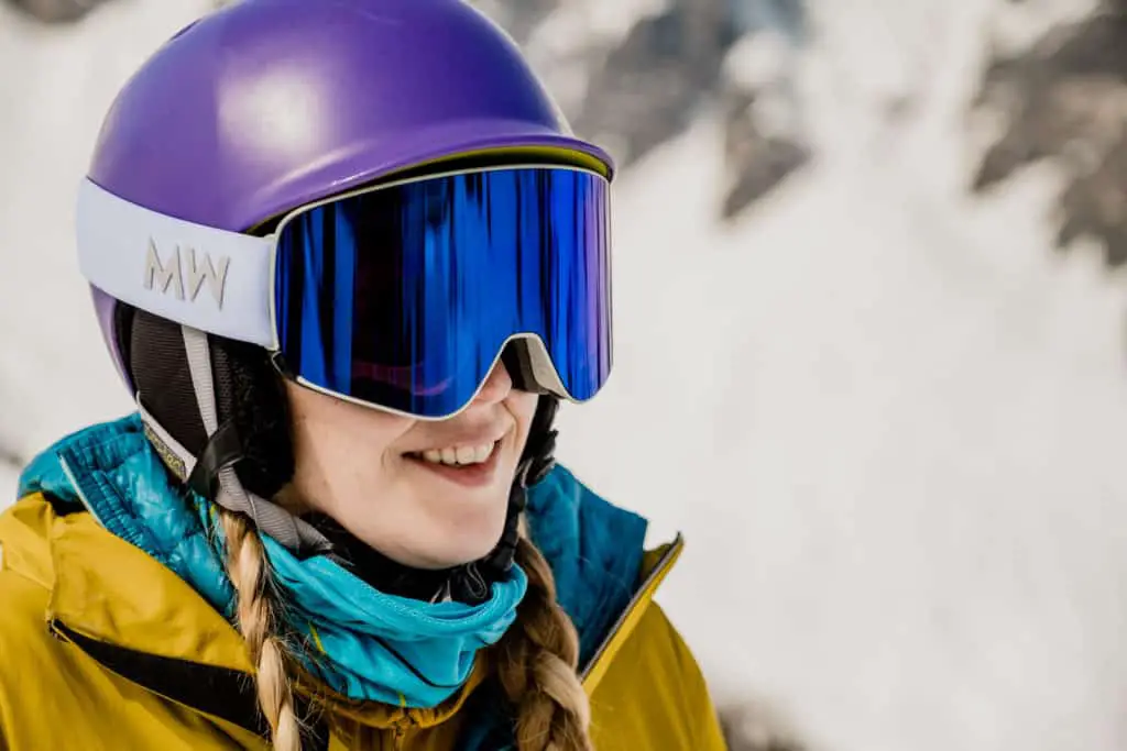 Blonde Skier wearing photochromic ski goggles from Messy Weekend