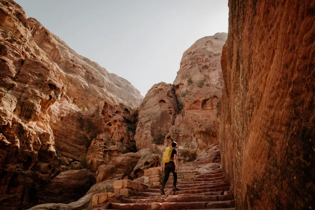 Man hiking the Al Khubtha (Treasury Viewpoint) Trail in Petra
